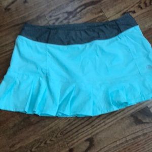 MPG running exercise skort. Pale blue color with gray waistband size large